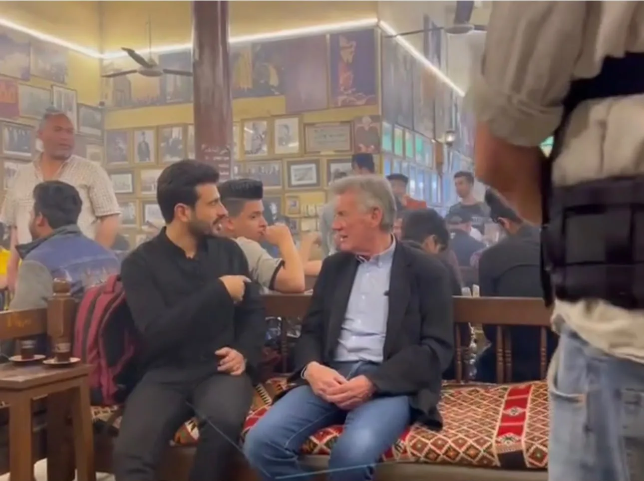Osamah Mousa with Michael Palin at a traditional Baghdad tea house