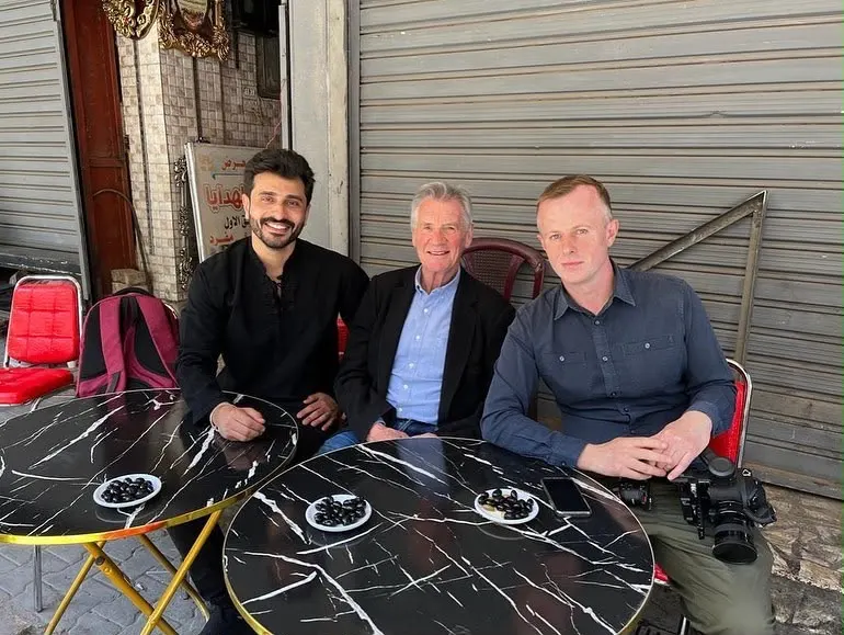 Osamah Mousa with international television guests at a Baghdad café